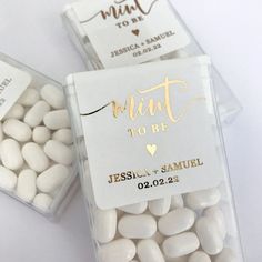 two clear bags filled with white and gold candy