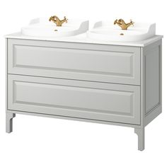 two white sinks with gold faucets on the top and bottom, against a white background