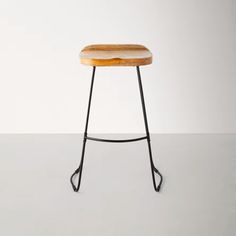 a stool made out of wood and metal with a wooden seat on the bottom, sitting in