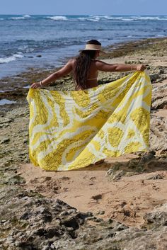 A beautiful canvas for the Lei Pīkake print designed by Kakou Collective. These pareo come in four bright colors - Guava, Sunshine, Ube and Sea Breeze. Use as a pareo at the pool or beach, a light scarf or cover up, a beach blanket to sit on and more. Approximately 72" x 42" 100% rayon Print designed by Kākou Collective Fabric softens with washing Machine wash cold Wash in cold water Tumble dry low Designed in Hawaii Valia Honolulu is a boutique with heart. We are located in Chinatown Honolulu i Beachy Multicolor Printed Sarong, Hawaiian Floral Print Beach Season Cover-up, Hawaiian Printed Sarong For Beach Cover-up, Hawaiian Floral Print Vacation Cover-up, Beach Towel Hawaii, Hawaiian Culture, Sea Breeze, Beach Blanket, Lei