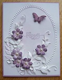 a card with purple flowers and butterflies on it