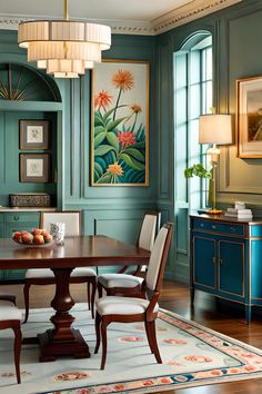 an elegant dining room with blue walls and wooden furniture, along with paintings on the wall