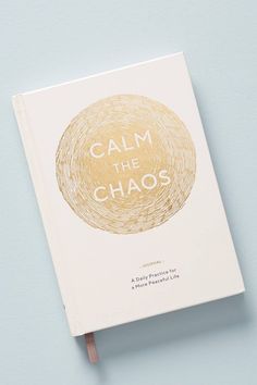 a book with the title calm the chaos written on it