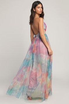 Show up in the Elegant Moment Multi Watercolor Backless Maxi Dress and steal the spotlight, plus every heart in the room! This gorgeous gown has a sheer mesh construction (atop a stretch knit liner), covered in an ultra-trendy rainbow tie-dye print. The gathered bodice boasts a sexy, plunging V-neckline and spaghetti straps that crisscross above the open back. Banded, empire waist shows off your figure while the stunning maxi skirt, with two peekaboo thigh-high slits, falls below. Hidden back zi Multicolor Backless Maxi Dress For Party, Summer Gala Maxi Dress With Sheer Back, Summer Maxi Dress With Sheer Back For Gala, Spring Party Maxi Dress With Sheer Back, Multicolor Floor-length Maxi Dress For Prom, Multicolor Maxi Dress For Prom, Multicolor Maxi Prom Dress, Multicolor Sheer Mesh Dress Fitted, Fitted Multicolor Sheer Mesh Dress