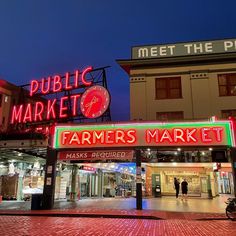 a public market is lit up at night