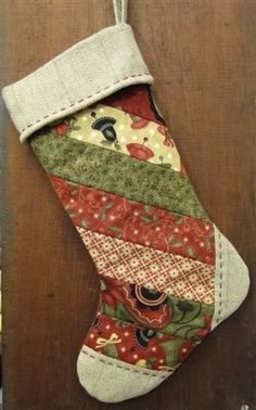 a christmas stocking hanging on a wooden door