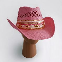 "Channel your inner Dolly Parton with this show-stopping pink straw hat that's more than just a hat, it's a STATEMENT.  Here's what makes this hat the belle of the ball : **  Glitz & Glam  Forget plastic! This hat is crafted from genuine straw, naturally breathable and oh-so-chic. But the real showstopper is the dazzling embellishment: rows of sparkling rhinestones that catch the light like a million pink diamonds, delicate pearls, and gleaming gold accents that'll make you the envy of every rod Pink Western Cap Hat, Western Style Pink Cap, Pink Western Style Cap, Summer Rodeo Cap-style Sun Hat, Summer Rodeo Sun Cap, Pink Wide Brim Hat For Rodeo, Western Style Top Hat For Summer Festivals, Western Style Summer Festival Top Hat, Country Style Summer Top Hat With Short Brim