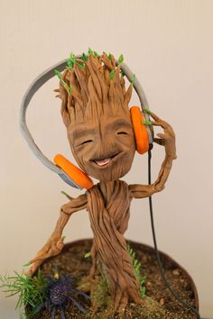 a statue of a groote with headphones on