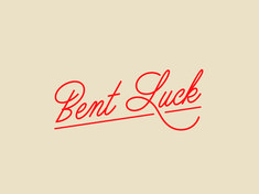 the word bent luck written in red ink