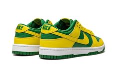 The Nike Dunk Low “Reverse Brazil” is a two-tone, yellow-and-green colorway of the retro basketball shoe that flips the color scheme of the model’s popular “Brazil” style.  As its name suggests, the “Reverse Brazil” reverses the color coordination of the “Brazil” Dunk, and it doesn’t miss the mark.  The shoe features Yellow Strike leather overlays and Swoosh branding on an Apple Green-colored leather base.  A green “Nike” logo is embroidered on the yellow leather heel tab.  Classic “Nike” detail Nike Dunk Low Reverse Brazil, Yellow And Green Dunks, Green And Yellow Sneakers, Green And Yellow Shoes, Green Sporty Basketball Shoes For Streetwear, Sporty Green Basketball Shoes For Streetwear, Green Throwback Sneakers For Streetwear, Casual Green Basketball Shoes For Streetwear, Green Basketball Shoes With Boost Midsole For Streetwear