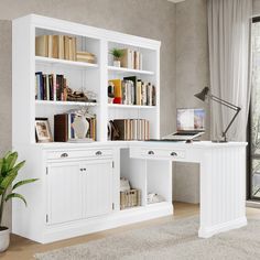 a white desk with bookshelves and a laptop on it