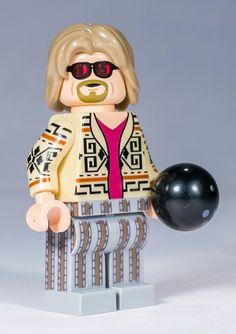 a lego figure holding a bowling ball and wearing sunglasses