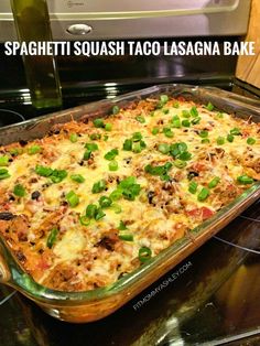 a casserole dish sitting on top of an oven with the words spaghetti squash taco lasagna bake above it