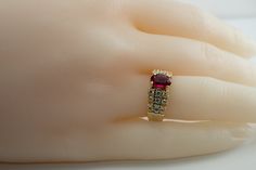 Genuine Diamond Ring, Red Ruby Ring, Vintage Ring, 18K Gold Ring, Gold Band, Natural Diamond Band, Elegant Ring. This vintage ring is made in solid 18K Yellow Gold. It has inscription inside of the shank dated 2.14.82. The center natural Earth mined Ruby measures 7x5mm (.90 carat). This stone is very clean and transparent. 24 natural round brilliant cut diamonds on the sides total .66 carat of VS2 clarity and H color. The setting raises 6mm high above finger. Size 5.75 (sizable). The ring weighs Red 14k Stamped Cluster Ring, Red Cluster Ring Stamped 14k, Heirloom Red Cluster Ring With Prong Setting, Fine Jewelry Red Diamond Ring Stamped 14k, Oval Ruby Cluster Ring Stamped 14k, Anniversary Red Cluster Ring Stamped 14k, Fine Jewelry Red Rings Stamped 14k, Heirloom Ruby Ring With Vvs Clarity, Heirloom Red Oval Diamond Ring