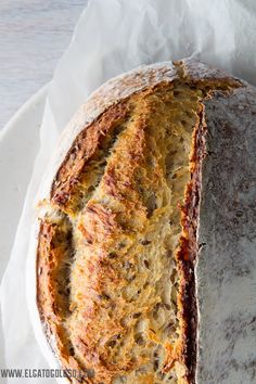 a loaf of bread sitting on top of a white plate