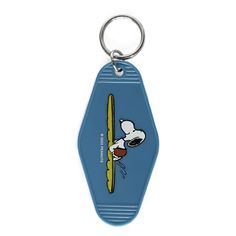 a keychain with a cartoon character holding a surfboard on it's side