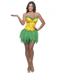 a woman dressed in a costume that is green and gold, with her hands out