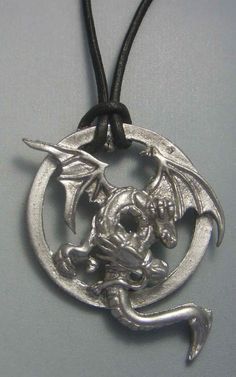 Two-headed dragon pendant, with leather cord included ( 45-50 cms or more if you need) called Anfisbaena. Dragon anfisbaena pendant is a talisman regenerator of health. Dragon pendant available in silver and gold. You can earn in two ways with the bead of leather, traditional way or with an informal knot. Dimensions of the dragon anfisbaena pendant: 3.9 cms x 3.1 cms ORIGIN OF THE DRAGON ANFISBAENA Anfisbaena pendant is a dragon with possible origin in the north of Africa - although its cult is Adjustable Sterling Silver Dragon Jewelry, Adjustable Sterling Silver Jewelry With Dragon Design, Silver Dragon Design Jewelry For Fantasy Events, Silver Fantasy Necklace With Hand Cast, Two Heads, Dragon Pendant, Silver 925 Necklace, Necklace Charm, A Dragon