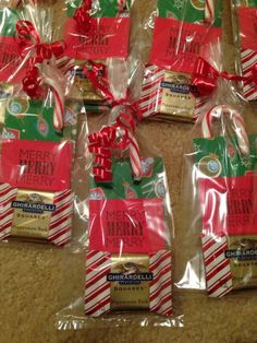 christmas candy wrapped in cellophane and tied with red ribbon on carpeted floor