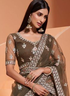 Buy Olive Green Embroidered Wedding Lehenga Choli In Germany online Embroidered Sets For Wedding And Diwali, Bollywood Style Net Sets For Wedding, Bollywood Style Wedding Net Sets, Bollywood Style Wedding Sets In Net, Bollywood Net Wedding Sets, Wedding Net Sets For Eid, Embroidered Dola Silk Sets For Wedding, Wedding Choli With Sheer Dupatta In Chinon, Wedding Sets In Dola Silk With Embroidery