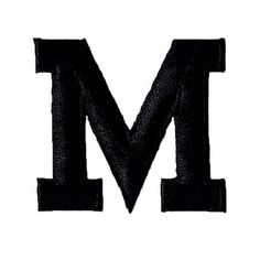 the letter m is made up of black fabric