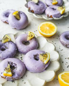 purple donuts with lemon slices and sprinkles on them