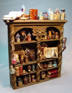 a wooden shelf filled with lots of different items