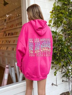 "This heavy blend hooded sweatshirt is made with a thick blend of cotton and polyester, it feels plush, soft and warm, a perfect choice for any cold day. This hoodie uses the affirmation words \"you are worthy, loved, needed, enough and you matter\" to bring kindness and positivity to anyone reading or wearing this sweatshirt. This hoodie spreads kindness to strangers and is bright pink in color♡ Runs true to size" Pink Fleece Hoodie With Graphic Print, Pink Hooded Hoodie With Letter Print, Positive Hoodie, Spread Kindness, You Matter, Words Of Affirmation, You Are Worthy, Color Run, Cold Day