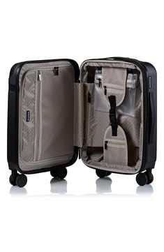 Travel smart with an easy-gliding suitcase featuring a lightweight hardshell to protect your essentials. 21" x 13.5" x 9" Telescopic top handle Zip around closure and expansion USB charging port, TSA locking mechanism 360-degree spinner wheels Polycarbonate Lined Imported Black Rectangular Cases For Overnight Trips, Rectangular Hard Shell Luggage For Business Trips, Portable Black Rectangular Luggage, Black Rectangular Portable Luggage, Black Portable Functional Luggage, Rectangular Hard Shell Travel Case, Modern Hard Shell Rectangular Case, Modern Rectangular Hard Shell Case, Modern Rectangular Hard Shell Cases