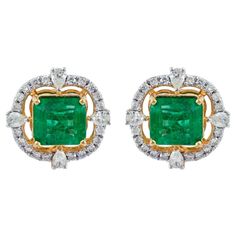 Cast in 14 karat gold, these stunning stud earrings are hand set with 4.60 carats emerald and 1.20 carats of glimmering diamonds. FOLLOW MEGHNA JEWELS storefront to view the latest collection & exclusive pieces. Meghna Jewels is proudly rated as a Top Seller on 1stDibs with 5 star customer reviews. All items manufactured by us are handmade and can be customized or redesigned. Certificate of authenticity available upon request. Composition Gross Weight 7.07 gm 14k Yellow Gold Weight 5.91 gm Diamo