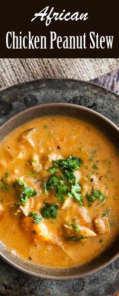 a bowl filled with chicken peanut stew on top of a table