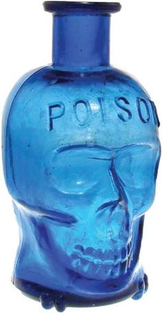 a blue glass bottle with a skull on it