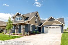 a large house with two garages in the front yard