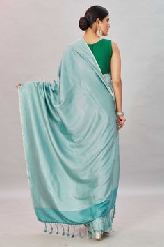 Look your ethnic best on special occasions in this green zari stripes Muga Banarasi saree. The saree comes with a pink blouse piece. Disclaimer: The shown stitched blouse on the model is for display purpose only. The saree comes with a matching blouse piece and finished with fall and piko. Unstitched Green Slub Silk Blouse Piece, Green Chanderi Anarkali Set With Zari Weaving, Designer Handloom Pre-draped Green Saree, Festive Green Pashmina Shawl In Traditional Drape, Festive Green Pashmina Shawl With Traditional Drape, Green Festive Pashmina Shawl With Traditional Drape, Green Cotton Silk Lehenga With Zari Weaving, Green Katan Silk Pre-draped Saree With Unstitched Blouse, Pista Green Handloom Blouse With Traditional Drape