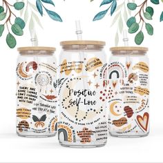 three mason jars with different designs on them