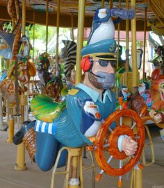 a merry go round with lots of animals on it