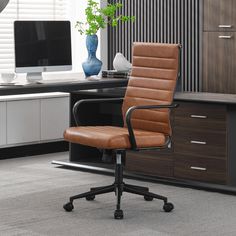 an office chair sitting in front of a computer desk