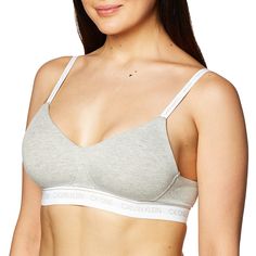 PRICES MAY VARY. CK ONE elasticated logo band and woven logo tag for an iconic refresh Lightly lined bralette silhouette and cushioned back closure Fully adjustable logo straps and molded cotton cups Update your look with a CK ONE thong Old Bras, Calvin Klein Bralette, Calvin Klein Ck One, Calvin Klein Bra, Bra Image, Ck One, Comfy Bra, Top Moda, Cotton Bras