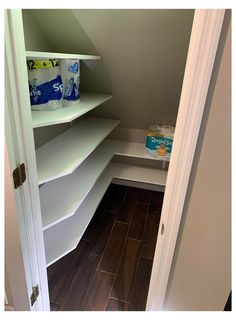 an empty closet with shelves and toiletries on the floor in front of door way