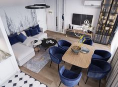 a living room filled with furniture and a flat screen tv mounted to the side of a wall