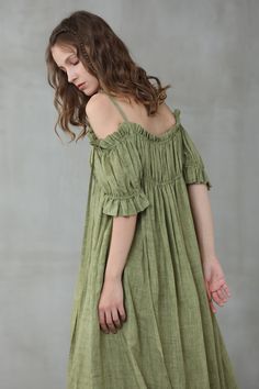 "This linen dress is full of contradictions, ensuring an eye-catching finish. The classic flared structure is contrasted by a slip design, whilst the ruffled details are given a contemporary twist with their asymmetric placement. In a moss green hue, this flared gown is here to turn heads at every event it attends. Off you go. 【Fabric】 95% linen, 5% silk it is Italian linen. exquisite high end texture. we add 5% silk to make it soft and exquisite. lightweight but a little sheer. looks gorgeous. Bohemian Green Linen Dress, Green Bohemian Linen Dress, Green Linen Bohemian Dress, Flowy Green Linen Dress, Summer Off-shoulder Linen Dress, Elegant Green Linen Summer Dress, Green Flowy Linen Dress, Elegant Green Summer Linen Dress, Linen Kaftan