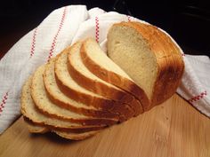 a loaf of bread sitting on top of a wooden cutting board