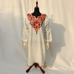 Discover the epitome of elegance with our Plain Off White Base Color Kurti Shirt, adorned with exquisite machine embroidery. The detailed patterns around the shoulders and neck create a charming contrast to the solid beige outfit, featuring stunning embroidery in pink, brown, and orange hues. Made from high-quality, soft pashmina, this frock ensures comfort and style for the summer and spring seasons. Its detailed embroidery and graceful patterns make it a perfect choice for semi-formal and formal events. Embrace versatility with this article, pairing it effortlessly with simple jewelry and statement shoes for various occasions. Ideal for both indoor and outdoor use, each uniquely crafted piece is available in limited quantity and sizing, ensuring you stand out with exclusivity and finesse Navratri Long Sleeve Salwar Kameez With Embroidered Border, Diwali Long Sleeve Salwar Kameez With Embroidered Border, Traditional Long Sleeve Salwar Kameez For Navratri, Navratri Long Sleeve Salwar Kameez With Intricate Embroidery, Embroidered Long Sleeve Salwar Kameez For Festivals, Bohemian Semi-stitched Kurta With Intricate Embroidery, Semi-stitched Bohemian Kurta With Intricate Embroidery, Traditional Long Sleeve Dabka Kurta, Long Sleeve Salwar Kameez With Intricate Embroidery