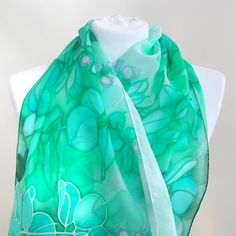 Jade silk scarf, hand paint with silk paint in green and turquoise shades on white. Size: 61 by 17 inches Silk: pure Habotai Light, semi transparent and a bit glossy This long, light scarf is ready to be shipped! It is hand painted with special silk paints that can be washed (for silk sake, please wash by hand! I am attaching an easy-to-follow instruction). The scarf won't fade! On this white and green silk wrap I have painted jade plant (you know it? Super popular indoor Crassula plant that bri Green Silk Scarves For Summer, Green Silk Bohemian Scarves, Bohemian Green Silk Scarves, Artistic Hand Painted Green Silk Scarf, Artistic Green Silk Scarf, Artistic Green Silk Scarf As A Gift, Hand Painted Green Silk Scarf, Green Bohemian Silk Scarf As Gift, Green Bohemian Silk Scarf For Gift