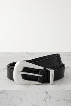 SAINT LAURENT's belt is punctured with a polished silver-tone buckle and tip that lend a decidedly Western feel. It's been crafted in Italy from smooth leather and engraved with the house's moniker at the loop. Dream Wishlist, Designer Hair Accessories, Silver Belts, Sports Trousers, Western Belts, Ballet Pumps, The Loop, High Jewelry, Ski Wear