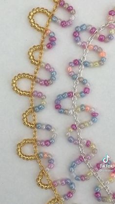 multicolored beaded necklace with gold - plated metal clasps and chain