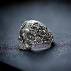 Embrace the fusion of gothic elegance and baroque artistry with our Silver Skull Oxidized Ring, crafted from high-quality 925 Sterling Silver. This striking ring features an intricately detailed skull design with a rich oxidized finish, enhanced by baroque style elements that add depth and character. The combination of the skull motif and baroque aesthetics creates a unique piece that symbolizes strength, mystery, and timeless elegance. Each ring is meticulously handmade, showcasing exceptional Skull Ring Aesthetic, Silver Gothic Skull Ring For Anniversary, Gothic Skull Rings With Engraving, Vintage Silver Skull Ring For Formal Occasions, Antique Engraved Sterling Silver Skull Ring, Gothic Silver Rings With Intricate Design, Sterling Silver Skull Rings, Oxidized Ring, Masonic Ring