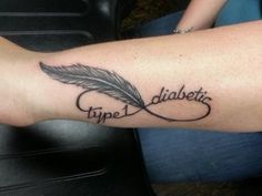 a person with a tattoo on their arm that says type 1, diabetia