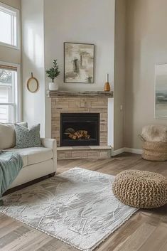 a living room filled with furniture and a fire place in the middle of the room