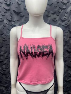 This is a pink Nausea crop tank top with spaghetti straps. This has a Nausea image screen printed on the front. 57% cotton/ 38% polyester/ 5% Spandex These are handmade screenprinted and slightly vary from the photo. Please feel free to email me any questions. Thanks for looking. I do not do exchanges and I do not take returns unless the item is damaged. I thoroughly check each item before it is shipped out. The seller is not responsible for any lost or stolen packages. Pink Sleeveless Y2k Crop Top, Y2k Tank Top For Spring Alternative Fashion, Spring Y2k Tank Top For Alternative Fashion, Trendy Screen Print Tank Top For Streetwear, Y2k Style Tank Top For Spring Alternative Fashion, Fitted Grunge Tank Top For Summer, Fitted Grunge Style Tank Top For Summer, Summer Music Festival Tank Top With Graphic Print, Y2k Pink Graphic Print Tank Top